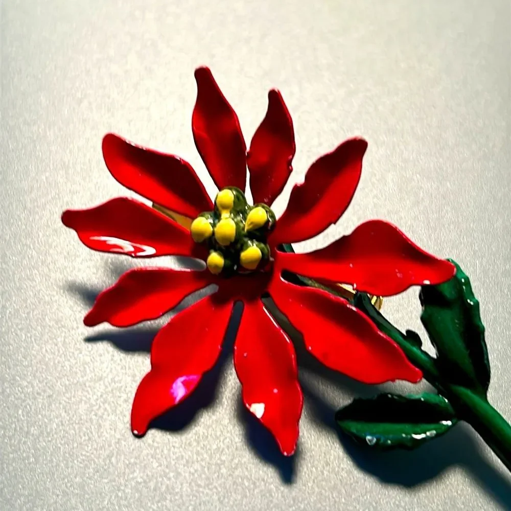 Vintage pointsettia and butterfly enamel on metal brooch set